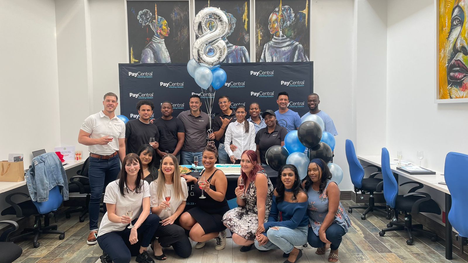 Eight years of PayCentral PayCentral team celebrating the company’s eighth anniversary with balloons and cake