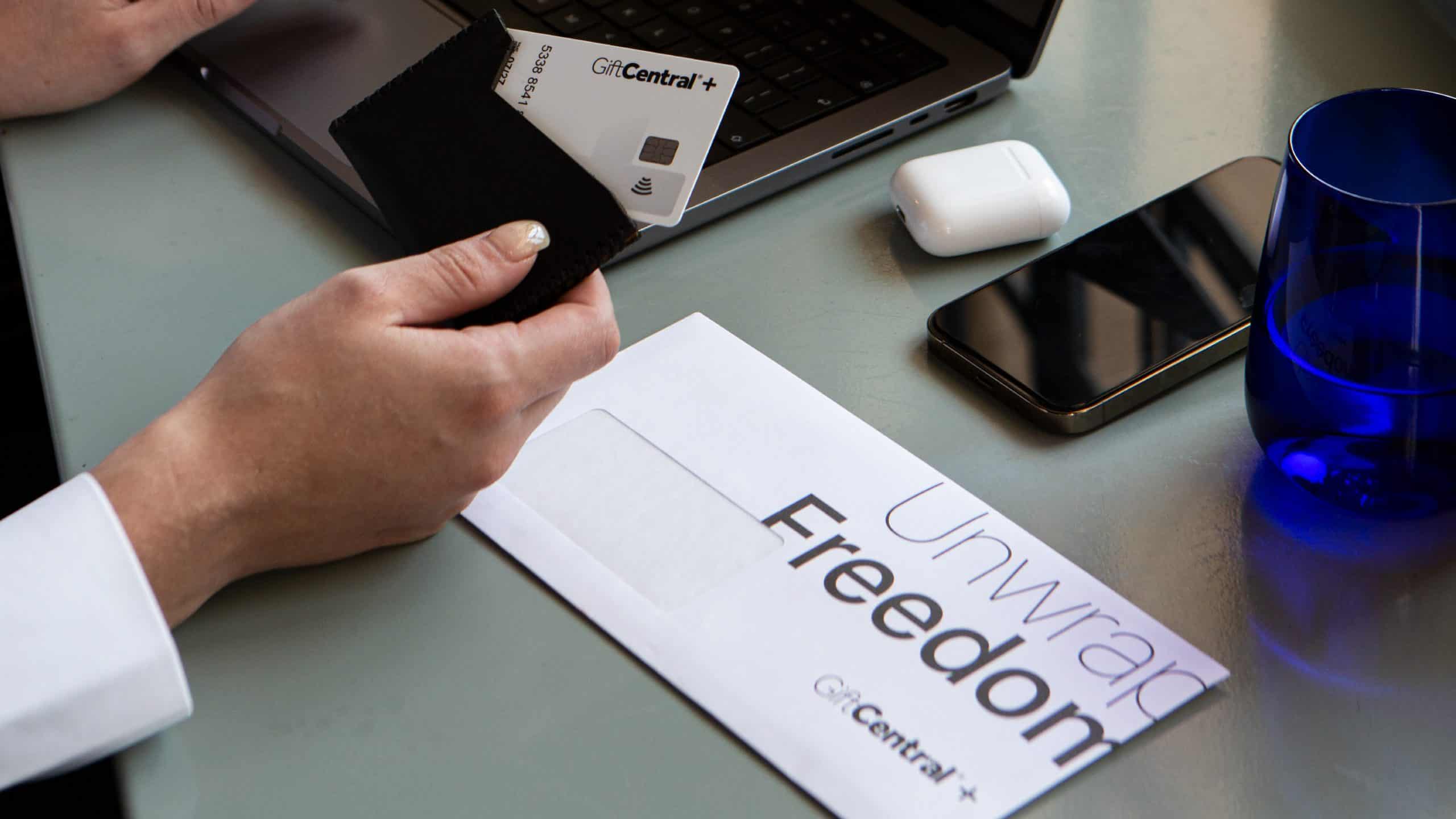 GIFTCENTRAL+ BLOG IMAGe high res v1 GiftCentral Plus prepaid card partially removed from wallet on office desk