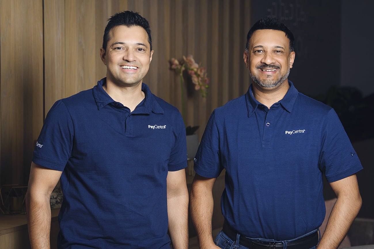 Direcctors Two PayCentral directors standing together wearing branded company shirts